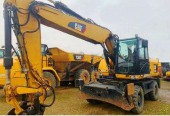 Bez vatu KOPARKA KOLOWA Caterpillar M318 D